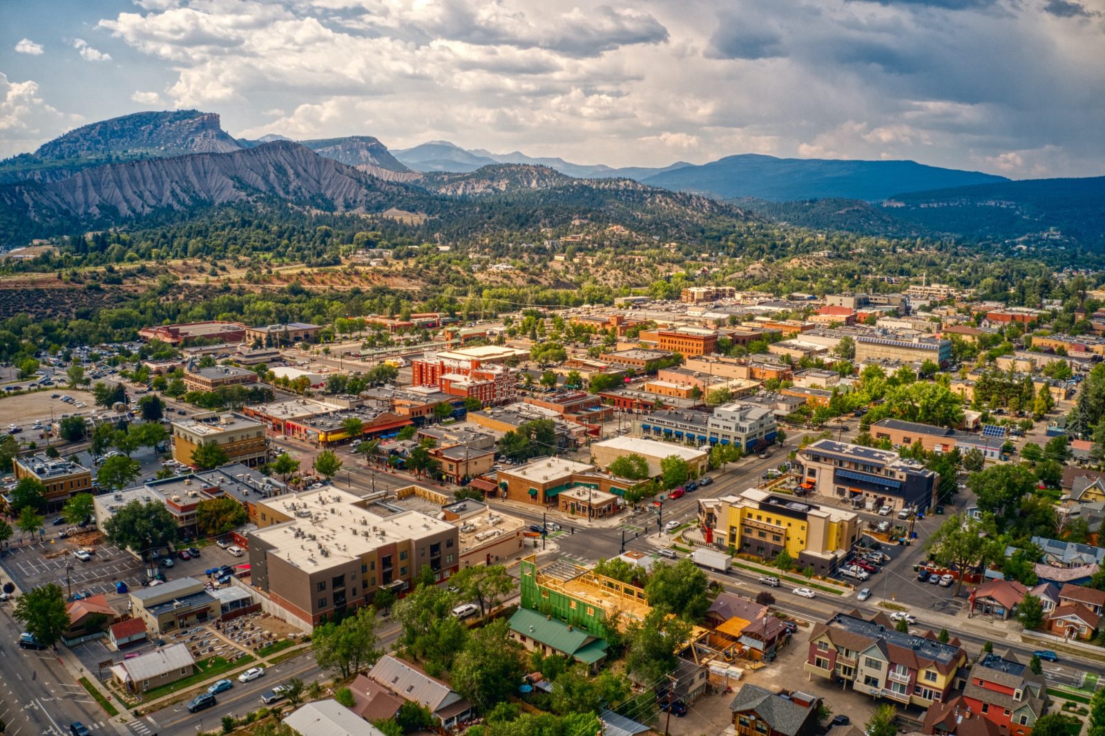 Aerial view of downtown Durango with mountains and forest in background